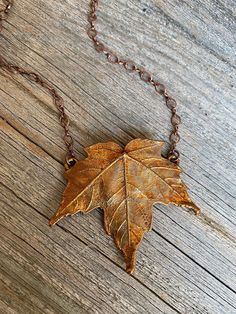 This necklace was made using a process called copper electroforming.  A real maple leaf has been painstakingly preserved and permanently encased inside of copper.  As the copper developed on the surface of the leaf, it perfectly preserved every tiny detail and vein.  A light patina enhances the natural textures and veining in the leaf, while creating a warm glow on the copper. The pendant has been sealed using Jewelry Shield.  The adjustable copper chain measures 21 inches long with a lobster cl Copper Necklace Rustica Jewelry, Electroformed Jewelry Necklaces, Hand Cast Copper Pendant Necklaces, Hand Cast Copper Pendant Necklace, Unique Copper Leaf Jewelry, Soldered Copper Rose Gold Necklace, Rose Gold Soldered Copper Necklaces, Rose Gold Soldered Copper Necklace, Bronze Copper Leaf-shaped Jewelry