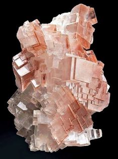 pink crystals are stacked on top of each other