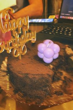 a birthday cake sitting on top of a wooden table