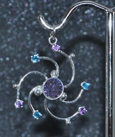 "This nebula small pendant in sterling silver with amethyst, titanium druzy quartz and apatite swirls with the whirlwind motion of space dust, space clouds and space ions. Amethyst, apatite and the beauty of fine quartz crystals coated with anodized titanium is just the right galactic combo of elements. This light and bright eye-catching piece will be a constant reminder that you are made of star stuff! This pendant is 1 1/8\" (28 mm) from top to bottom and 1\" (25 mm) at the widest point. At th Silver Amethyst Hypoallergenic Jewelry, Hypoallergenic Amethyst Silver Jewelry, Hypoallergenic Silver Amethyst Jewelry, Silver Spiral Gemstone Jewelry, Purple Sterling Silver Fusion Jewelry, Silver Celestial Multi-stone Jewelry, Silver Multi-stone Celestial Jewelry, Space Clouds, Space Dust