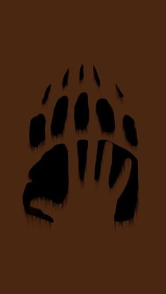 an animal's paw print on a brown background