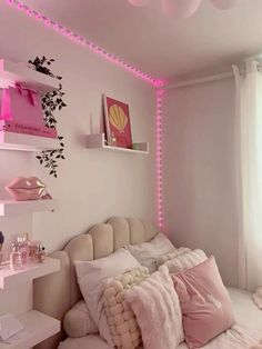 a bedroom with pink lights on the ceiling