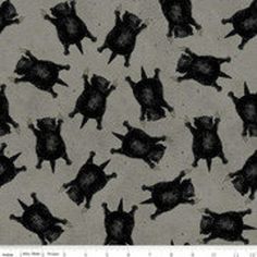 an animal pattern is shown in black and white on a gray background, with the silhouettes of cats