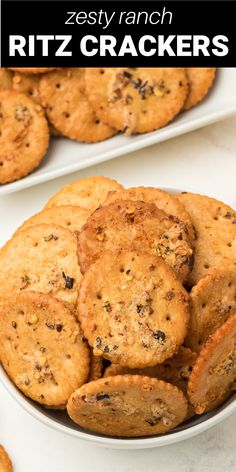 two white plates filled with cookies on top of a table