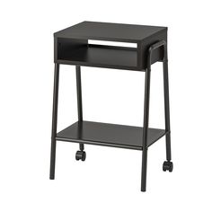 a small black table with wheels and a shelf on the top that has an open drawer