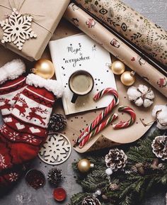 an assortment of christmas decorations and gifts on a table