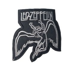 a black and white patch with an image of a winged bird on it's back