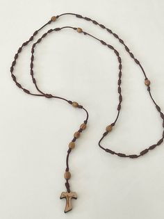 I OFFER HERE THIS NEW - UNIQUE Handcrafted olive rosary. Can also be worn as a necklace. It is not a mass-produced product and production is limited. Given the peculiarity of the wood the nuances can change. Olive wood beads. The Rosary is 64cm long. Feel free to ask any questions pertaining to this item. Thank you. I Have some more and different Rosaries, if You like to have some more please contact me. I Shipp Worldwide - Adjustable Crucifix Jewelry With Wooden Beads, Adjustable Wooden Bead Crucifix Jewelry, Adjustable Cross Jewelry With Wooden Beads, Adjustable Cross Necklace With Wooden Beads, Adjustable Wooden Beads Cross Jewelry, Adjustable Cross Necklace With 108 Beads, Brown Spiritual Necklaces With Adjustable Length, Brown Spiritual Necklace With Adjustable Length, Brown Crucifix Necklace In Spiritual Style