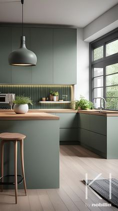 a kitchen with green cabinets and stools next to an island counter top in front of a window