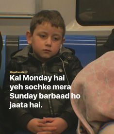 a little boy sitting on top of a bus seat