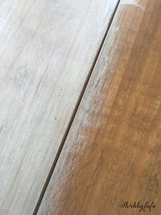 a close up view of the wood grains on a wooden table with white paint