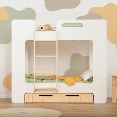 a child's room with a bunk bed and wooden toys on the floor in front of it