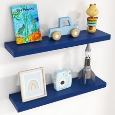 two blue shelves with toys and pictures on them