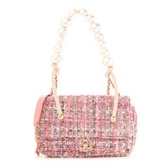 This is an authentic CHANEL Tweed Medium Pearl Handle Flap in Pink, Beige, Orange, and Ecru. This stylish shoulder bag is beautifully crafted of pink tweed. The bag features an oversized pearl top handle, a gold chain leather-threaded shoulder strap, and a front flap with a gold Chanel CC turn lock. This opens the front flap to a pink fabric interior with a zipped pocket. Luxury Tweed Shoulder Bag, Luxury Tweed Evening Bag, Luxury Tweed Crossbody Shoulder Bag, Elegant Tweed Top Handle Bag, Designer Tweed Top Handle Bag, Chic Tweed Top Handle Bag, Chic Tweed Evening Bag, Elegant Beige Tweed Bags, Luxury Shoulder Bag With Pearl Handle For Shopping