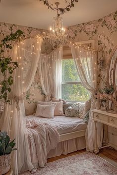 a bedroom decorated in pink and white with flowers on the walls, curtains, bedding, and lights hanging from the ceiling