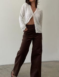 Adding richness and texture to any look, these corduroy pant feature a structured, high-rise fit with a classic wide leg finish. Cut from a velvety corduroy fabrication in deep macchiato brown, these timeless trousers style flawlessly with a flannel + sneakers or make them work-ready with a tucked button down and chunky leather loafers. 97% cotton, 3% spandex Slight stretch Zipper + button closure SMALLwaist - 26"* / hip - 36" / length - 41" / rise - 11.5" / inseam - 29.5" MEDIUMwaist - 28"* / h Brown Corduroy Pants Outfit Aesthetic, Brown Corduroy Outfit, How To Style Corduroy Pants, Corduroy Pants Outfit Aesthetic, Brown Courdory Pants Outfit, Brown Trouser Outfit, Texas Thanksgiving, Brown Corduroy Pants Outfit, Brown Trousers Outfit