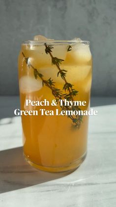 a glass filled with green tea and lemonade