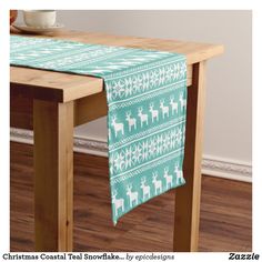 a table with a christmas pattern on it