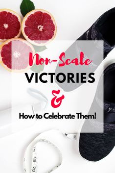 a pair of black shoes sitting on top of a table next to grapefruits