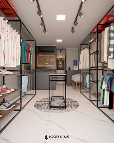 the inside of a clothing store with clothes on racks