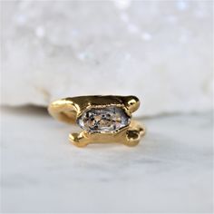 Herkimer diamond dipped in gold. Size 4 Nature is a strong force flowing through our jewelry. We let the raw gemstones do the talking. Each unique stone determines the shape and style each design will take on. In return, we achieve an organic and luxe feel. All of our jewelry is one of a kind. ::The process of gold dipping:: Handpicked stones are arranged and set in copper. A generous layer of 18k gold is then applied. ♥ Thank you for shopping Cocolina ♥ Open Ring Gold, Herkimer Diamond Ring, Ring Crystal, Etsy Gold Ring, Herkimer Diamond, Raw Gemstones, Open Ring, Ring Gold, Crystal Jewelry