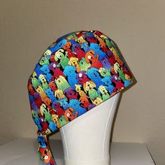 "Handmade scrub cap/hat/bonnet for women.  Made with 100% cotton fabric for breathability, durability, practicality. Perfect in the workplace for nurses, doctors, operating room staff, medical, dental, veterinary, or anyone else who needs to keep head and hair covered and in place. Fabric features various colorful and adorable dogs. \"Full Coverage\" fit:  works well with both long hair and short hair.  Please look at the uploaded photos to see that my very long and thick hair fits well into thi Fun Cotton Beanie Hat, Playful One Size Bonnet Cap, Adjustable Fun Style Bonnet Cap, Fun Adjustable Cap-shaped Bonnet, Adjustable Fun Beanie Bonnet, Fun Adjustable Beanie Bonnet, Adjustable Multicolor Cotton Bandana, Cute Multicolor Cotton Hats, Long Hair And Short Hair