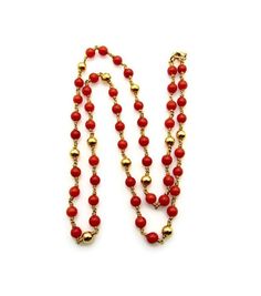 "18K Yellow Gold Coral and Gold Beads Necklace Measures 19.5\" long or 48 cm 48 round coral beads measuring in average 4.4 mm each 11 round 18K yellow gold beads measuring in average 4.5 mm each Fastens with a 18K yellow gold lobster clasp in good working condition Stamped: \"750\" This necklace is in very good vintage condition, no flaws to note. Total weight: 13.7 grams 0324-5713  RL-0936 FEEL FREE TO MESSAGE ME IF YOU HAVE ANY QUESTIONS OR WISH TO SEE MORE PICTURES  * Back to Shop Watch and W Red Round Beads Necklace For Formal Occasions, Formal Red Single Strand Necklace, Red Rondelle Single Strand Beaded Necklace, Gold Beaded Necklaces With Red Coral Round Beads, Elegant Red Coral Necklace With Gold Beads, Formal Red Beaded Necklaces With Polished Beads, Formal Red Beaded Necklace With Polished Beads, Luxury Beaded Necklace With Round Beads, Elegant Orange Necklace With Spacer Beads