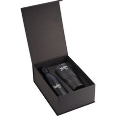 two bottles in a black box on a white background