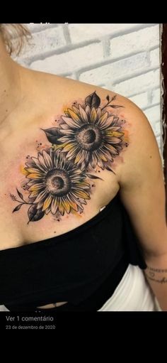 a woman's chest with sunflowers on it