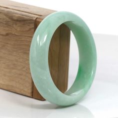 * DETAILS--- This bangle is made with very high-quality genuine Burmese Jadeite jade. The jade texture is fine and smooth with apple green color. It looks so beautiful in a wider size. It's a luxury gift for you and your love. It's a collectible item.* Specifications: approx.TW: 76.12 gSize: 58.24 mmWidth: 16.12 mmThickness: 8.24 mmMaterial: Genuine Burmese Green Jadeite JadeStyle: Princess Half RoundCircumference: 7.2 in * Bangle Size: XL (60 mm-66 mm), L (58 mm - 60 mm), M ( 56 mm - 58 mm ), S Apple Green Color, Jade Bangle, Jade Bracelet, Jade Jewelry, Apple Green, Burmese, So Beautiful, Bangle Bracelet, Collectable Items