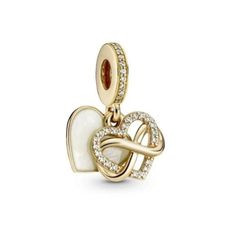 New Pandora Sparkling Infinity Heart Dangle Charm Gold-Tone Brand New Authentic Retails for $150 *All of my Pandora Jewelry is Brand New and Authentic. I purchase wholesale orders from them. Your purchase will include a Pandora Dustbag and the Tag, also a box and cleaning cloth. Check out the rest of my shop for more Brand New Pandora Jewelry!! :) Pandora Gold Jewelry, Gold Pandora Bracelet Charms, Pandora Bracelet Designs, Dream Bracelet, Pandora Jewelry Charms