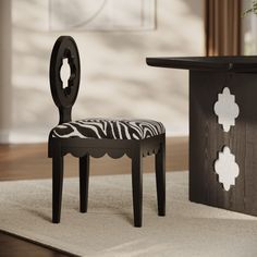 a zebra print chair sitting next to a table