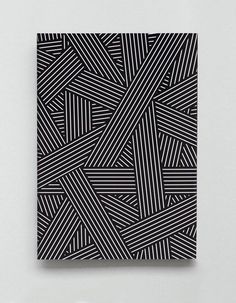 an abstract black and white pattern with diagonal lines in the center, as if it was made out of paper