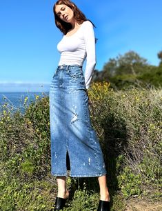 This is our Beloved Relaxed Maxi Skirt — gorgeous wash and distressed detail, in our ultra-premium denim, with pieced construction. We love it! The model is 5'9" wearing a size 26 Fabric: 98% Cotton 2% Spandex Length: 35" from waistband Distressed High Waist Fitted Skirt, High Waist Fitted Distressed Skirt, High Waist Distressed Fitted Skirt, Chic Distressed Denim Skirt For Spring, Chic Fitted Ripped Denim Skirt, Full Length Medium Wash Denim Skirt With Frayed Hem, Chic Distressed Cutoff Denim Skirt, Chic Ripped Fitted Denim Skirt, Distressed High Rise Fitted Skirt