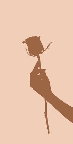 a person's hand holding a dead rose up in the air with its shadow