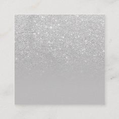 a white and silver glitter card