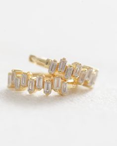 Our Crystal Baguette Huggies are the perfect accessory for any outfit. Crafted from 14k gold vermeil, these huggies feature a crystal baguette design for a touch of luxury and sparkle. Everyday Gold Huggie Earrings With Baguette Cut, Gold Cubic Zirconia Baguette Cut Huggie Earrings, Gold Baguette Cut Cubic Zirconia Huggie Earrings, Gold Huggie Earrings With Baguette Diamonds In 14k Gold, Gold 14k Baguette Diamond Huggie Earrings, Stacked Jewelry, New Launch, Jewelry Case, Simply Beautiful