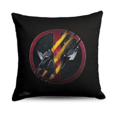 a black pillow with a yellow and red striped peace sign on the front, sitting in front of a white background