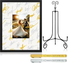 a wedding photo and pen are shown next to an easel with writing on it