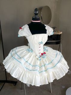 This stunning dress features a corset waist design in a beautiful white and blue color combination. The detachable puff sleeves add a touch of versatility, while the smocked elastic at the back ensures a comfortable and flattering fit. Perfect for creating a stylish and feminine look with a touch of Lolita charm.   	 		 			Size 			XS 			S 			M 			L 		 		 			Full Length 			56.5 			57 			58 			59 		 		 			Bust 			70-92 			72-94 			76-100 			80-106 		 		 			Waist 			57-86 			60-88 			64-92 			68-96 		 		 			Sleeve Length 			78 			78 			78 			78 White Puff Sleeve Dresses In Princesscore Style, White Princesscore Dress With Puff Sleeves, White Princesscore Puff Sleeve Dresses, Princesscore White Puff Sleeve Dresses, White Corset Dress With Puff Sleeves And Ruffles, White Corset Dress With Ruffles And Fitted Bodice, White Square Neck Corset Dress With Ruffles, Fitted Puff Sleeve Corset Dress With Ruffles, Fitted Bodice Corset Dress With Puff Sleeves And Ruffles