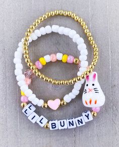 Lil Bunny Bracelet Stack 🐰 Perfect for Easter Basket Stuffers 🐣🐰 ✨Customize with a name, put in Personalization section ✨ CARING TIPS FOR YOUR JEWELRY ⭐️Treat and store with care. ⭐️ For longevity, avoid exposing your jewelry to water. ⭐️ Avoid having direct contact with lotions, perfumes, sanitizers as these chemicals may cause discoloration of your jewelry. Easter Bracelets, Bunny Bracelet, Easter Accessories, Bracelets Colors, Selling Stuff, Colorful Bead Bracelets, Preppy Things, Easter Basket Stuffers, Bracelet Craft