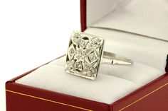 This fantastic ring is made in brilliant 14K white gold with dazzling pave set diamonds. This Mosaic square styled cocktail ring is set with 0.75ct total weight in white diamonds. The head of the ring is 16.22mm wide 16mm long and sits 6mm tall. The ring is a size 7.75 and can be resized upon request. B955FYSPD --Please reference our policy for more details-- For International orders, please provide a phone number for shipping purposes. Just place a note in the comment box during check out.Thank Elegant Rectangular Platinum Diamond Ring, Dazzling Square Cut White Gold Diamond Ring, Rectangular Brilliant Cut Diamond Ring In Art Deco Style, Rectangular Diamond Ring In Platinum, Rectangular Platinum Diamond Ring, Art Deco Rectangular Brilliant Cut Diamond Ring, White Gold Square-cut Diamond Ring With Vvs Clarity, Diamond White Rectangular Platinum Diamond Ring, Dazzling Rectangular Diamond Ring For Anniversary