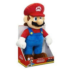 a stuffed toy in the shape of mario is sitting on top of a cardboard box