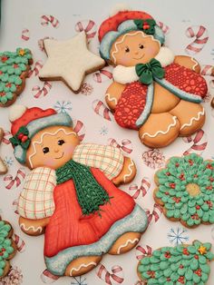 decorated cookies are displayed on a table