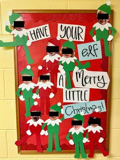 an elf bulletin board with paper cutouts on it