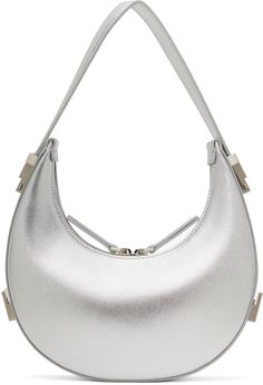 Metallic foil-coated buffed leather top handle bag in silver tone. · Adjustable sliding carry handle · Logo embossed at back face · Two-way zip closure · Patch pocket at interior · Brushed jersey lining · Logo-engraved silver-tone hardware · H4.5 x W8.5 x D2.25 Supplier color: Silver Silver Bag, Silver Bodies, Silver Bags, Silver Engraving, Metallic Foil, Leather Top, Patch Pocket, Apparel Accessories, Mini Bag