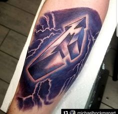 a man with a lightning tattoo on his arm