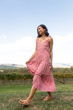 Feel alive in the airy Viviana; a multiway midi dress to stand the test of time and complete your capsule wardrobe. Dainty yet playful, alluring yet striking. A pink gingham staple piece taking your sun dress to new heights with its multifunctional and practical design and fun, feminine print. Sway into any occasion with considered lightweight fabric made for the warmer temperature or team with boots and a light-weight knit for the cooler seasons. 
 Thoughtfully crafted to be customisable and wo Postpartum Tummy, Multiway Dress, Multi Way Dress, Reversible Bikinis, Practical Design, Pink Gingham, Pink Maxi Dress, Gingham Print, Sun Dress