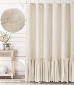 a beige shower curtain with ruffles and a white wall in the back ground