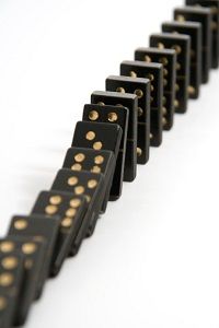 a row of black and gold dominos sitting on top of each other